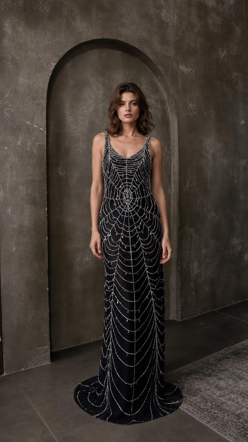 Front view of black beaded evening maxi dress