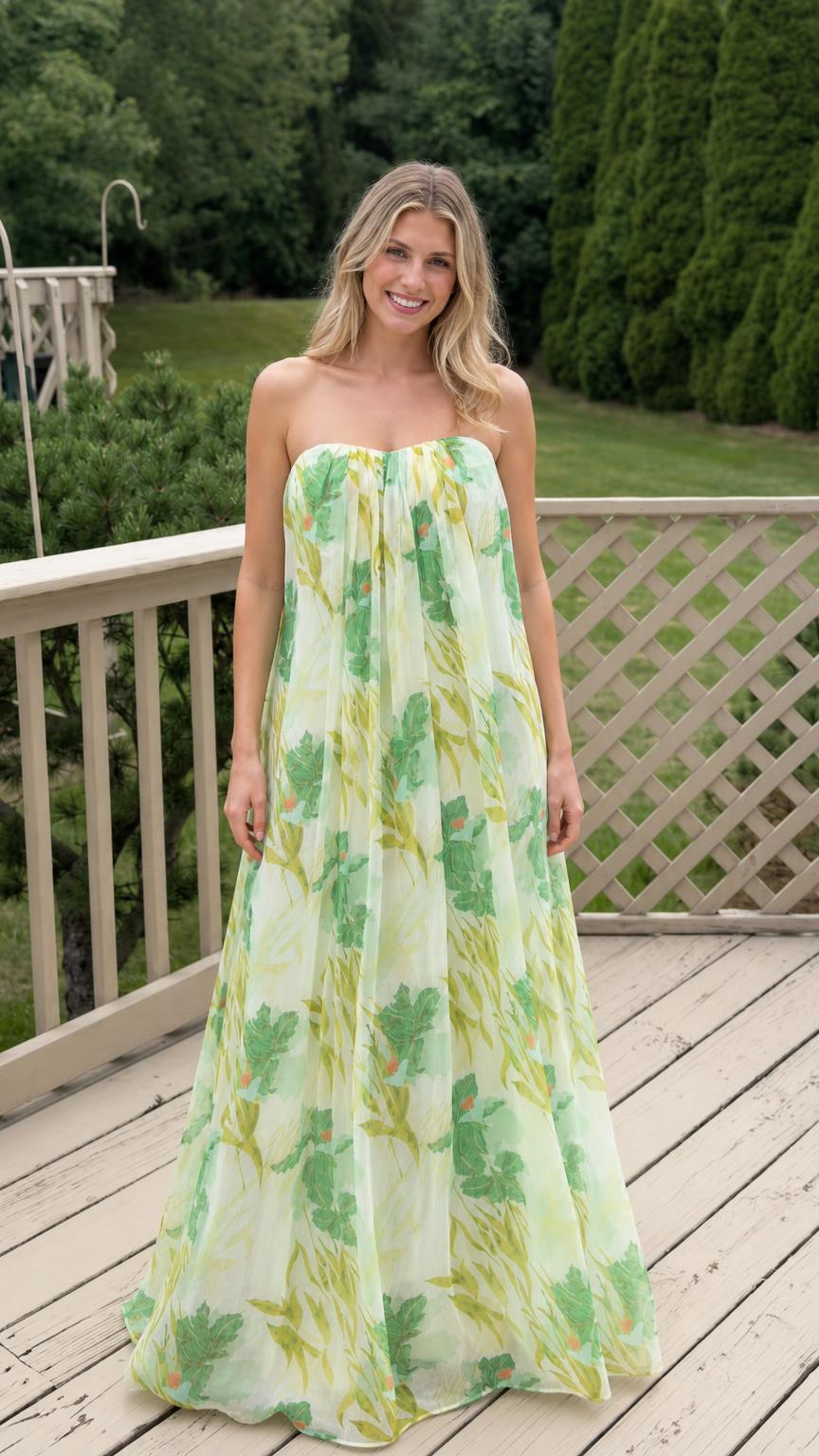 Front view of model wearing white floral strapless maxi dress