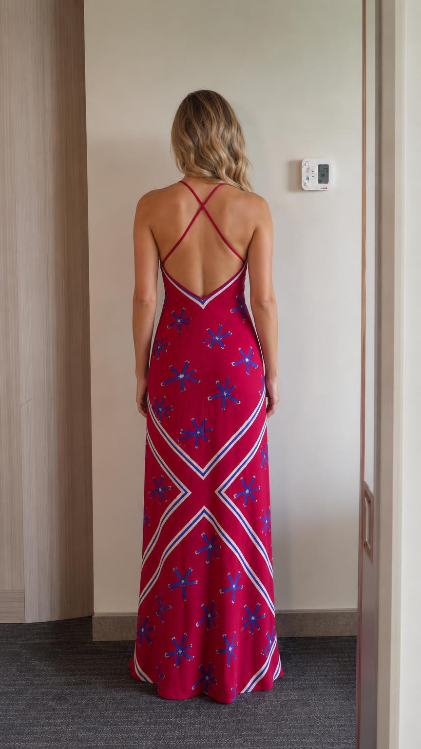 Back view showing cross straps on red maxi dress