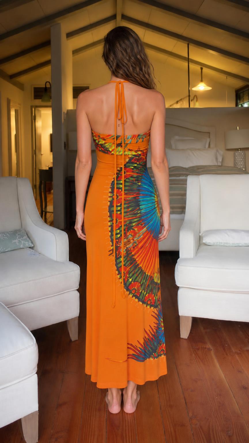 Back view of model wearing orange halter maxi dress