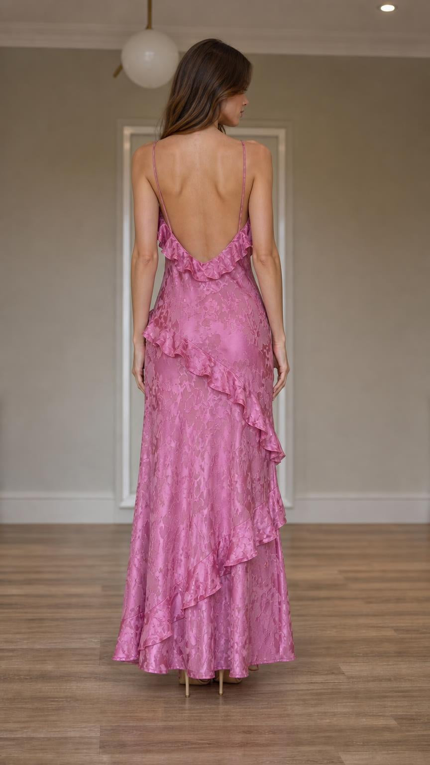 Back view showcasing open back design of pink slip dress